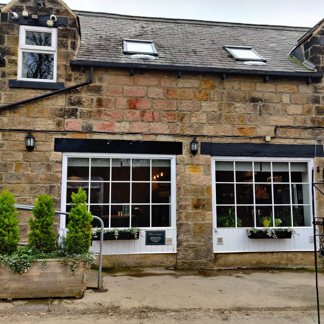 Front view of the Three Cottages Cafe in Meanwood Park along the Meanwood Valley Trail